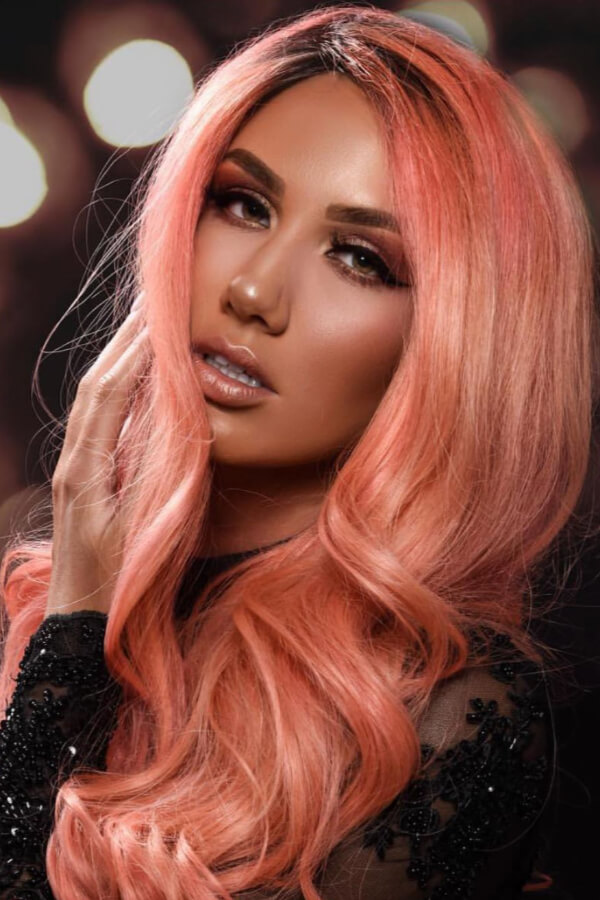 Want to make a statement with your hair? Try this pastel orange shade!