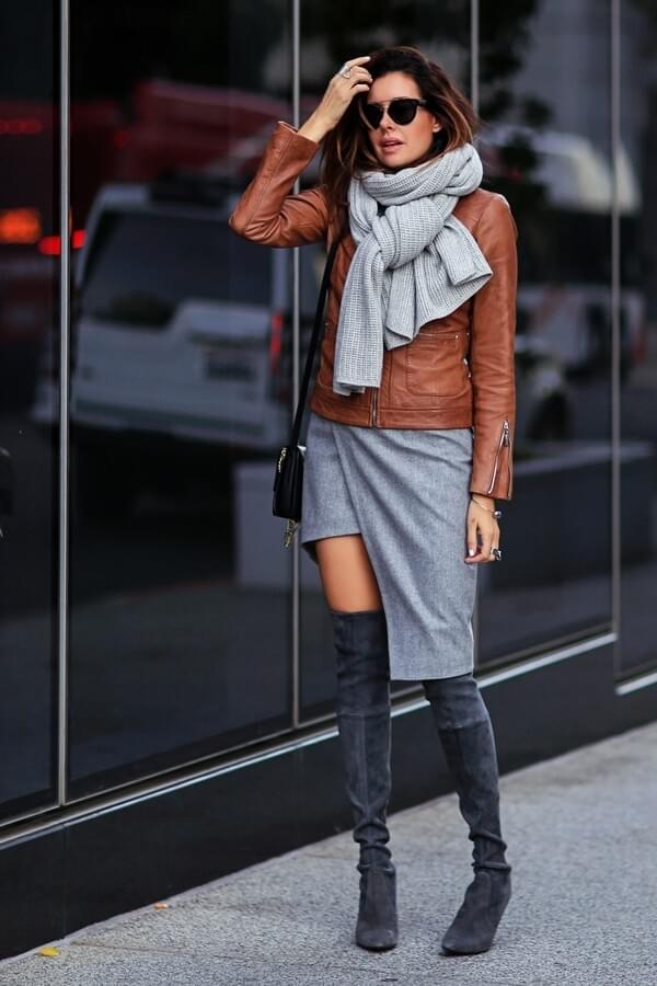 Outfit with asymmetric skirt, leather jacket, and grey suede boots