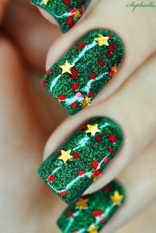 This might be the best way to revive the Christmas tree on your nails. Cover your nails in green sparkly nail polish and add red berry details along with gold stars. #winternails #naildesign