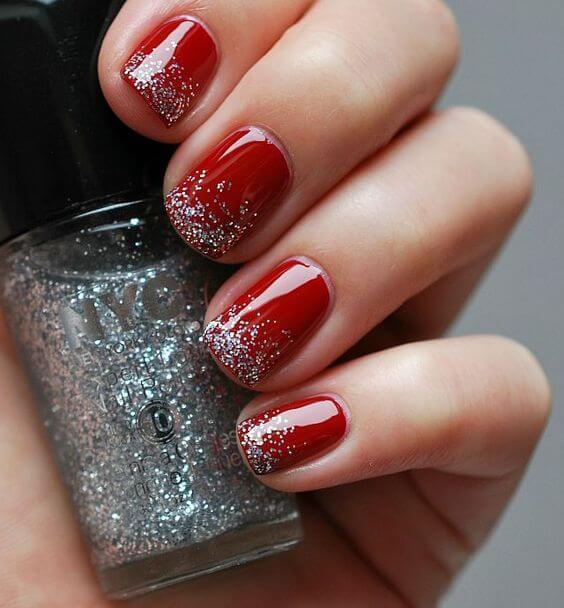 Red on your nails is the impeccable choice for any season. However, adding sparkly nail polish adds more holiday spirit. #winternails #naildesign