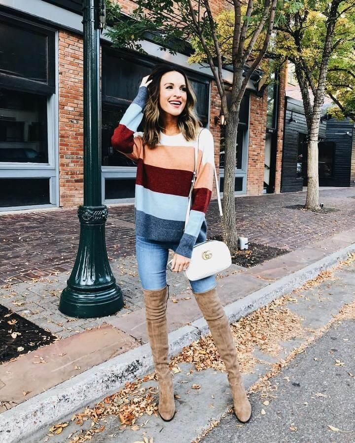Never say no to striped sweaters or tops. They can be your favorite item no matter what season is. Combined with both jeans or skirts they can look pretty interesting and playful. The only thing you need to do is to find beige thigh-high boots that will keep you warm during cold months.
