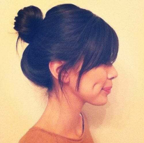 Keep it short and simple with bangs and a bun.