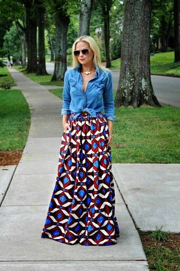 woman in the park dressed up in denim shirt and long geometrically patterned skirt. Geometrical patterns looks fabulous on a maxi skirt.