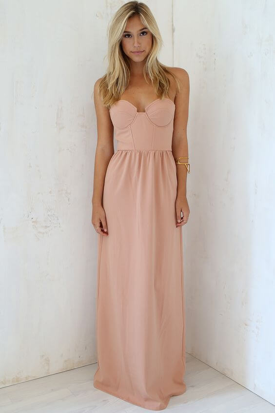 Girl with long dress looking elegant and feminine. A perfect dress to express your feminine look.