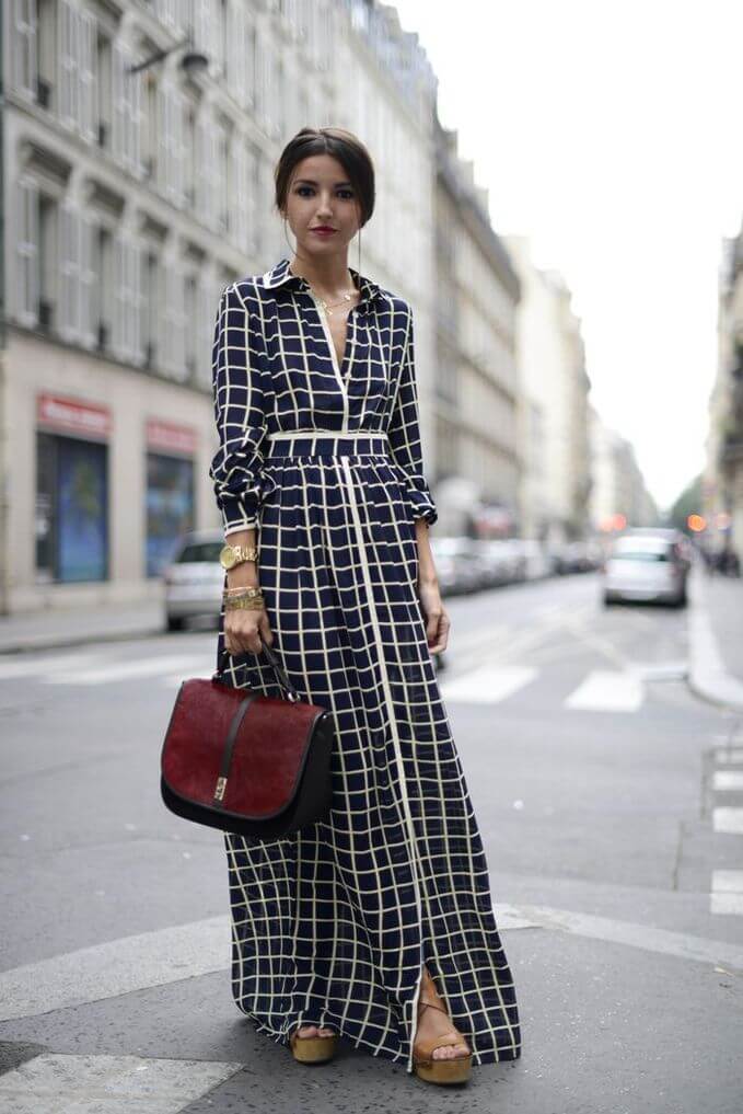 Woman in the street with a vintage style long maxi dress, together with platform heels. Great outfit with a vintage style long maxi dress.