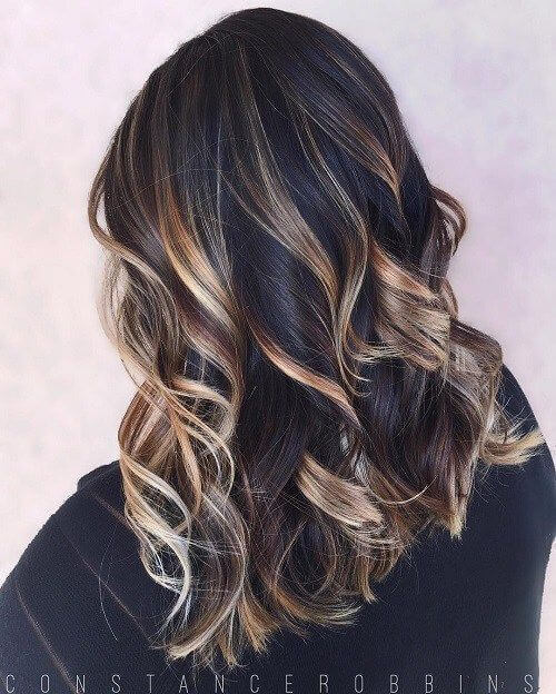 dark brown hair with gold, platinum, and light brown highlights.
