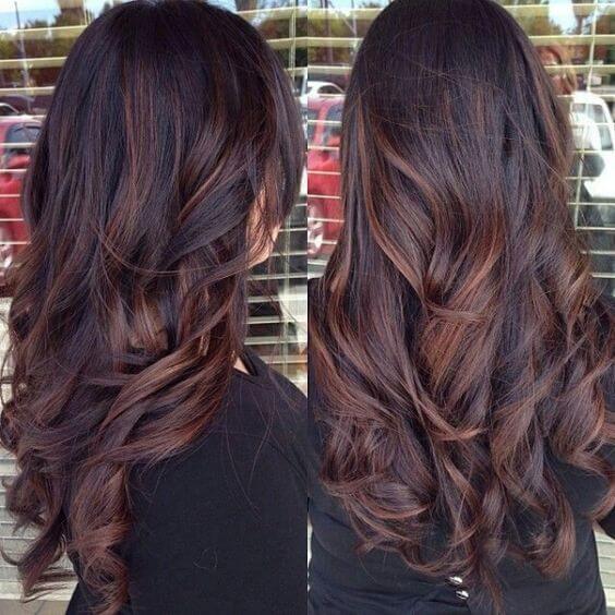 long, dark, chocolate brown wavy hair with auburn highlights
