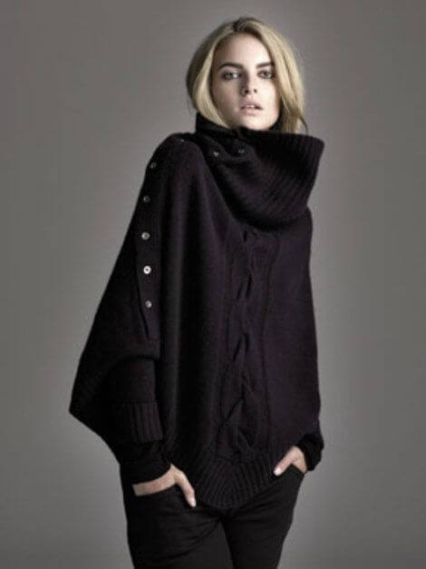 Oversized knitted sweater with batwing sleeves and high neck.