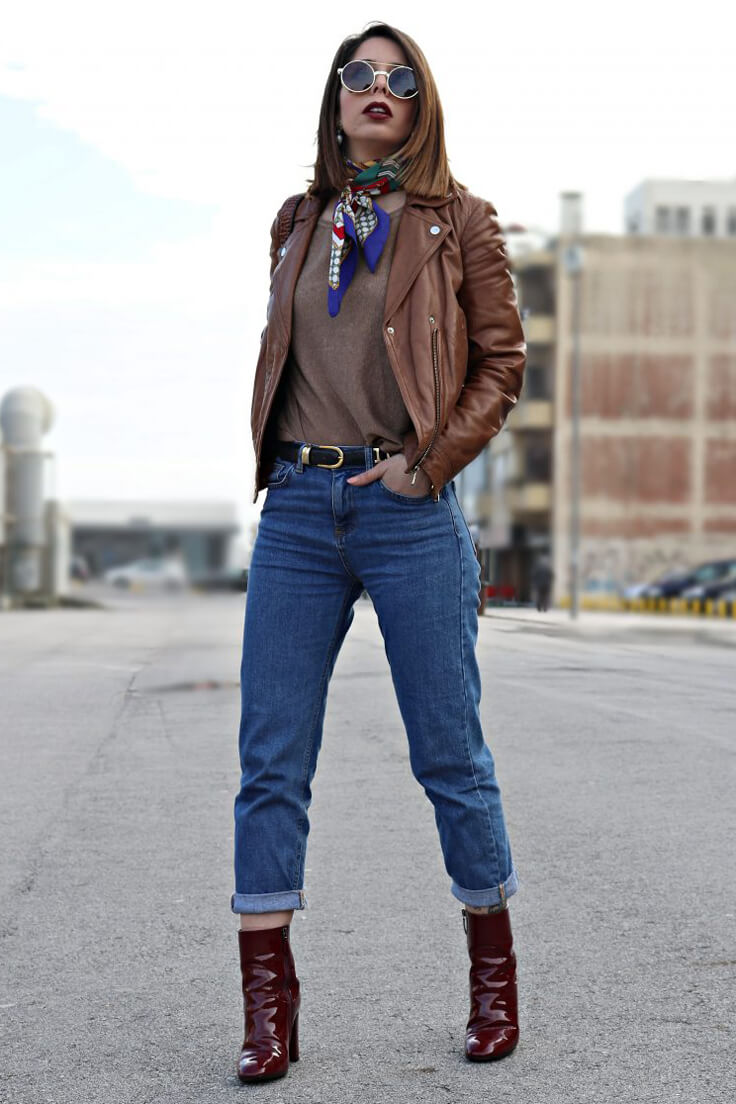 Woman in jeans and leather jacket