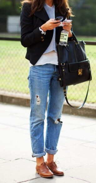 Preppy brogue shoes take the spotlight when paired with edgy cuffed boyfriend jeans.