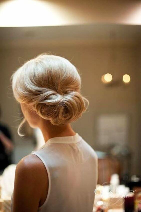 Up the elegance factor on your updo by doing a vertical French twist.
