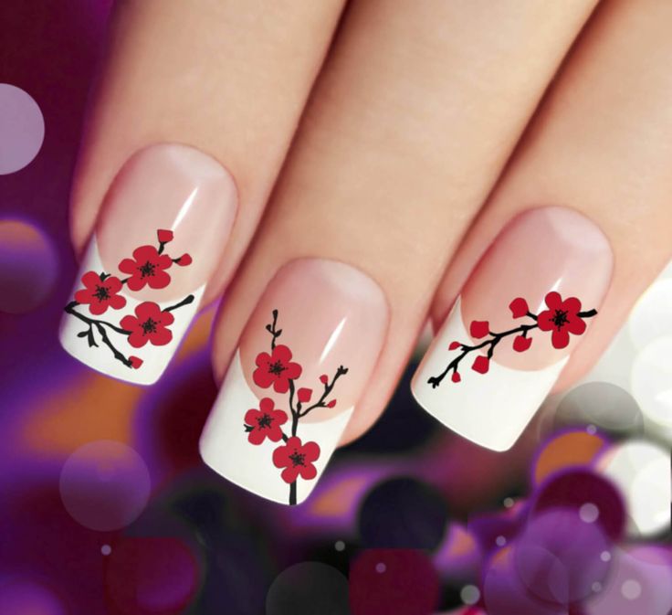 Decorate your manicure with these red flowers reminiscent of cherry blossoms.