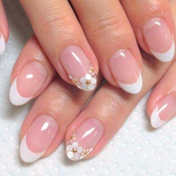 While it may seem like your ordinary pink and white French manicure from far away, up close it's a complete work of art.