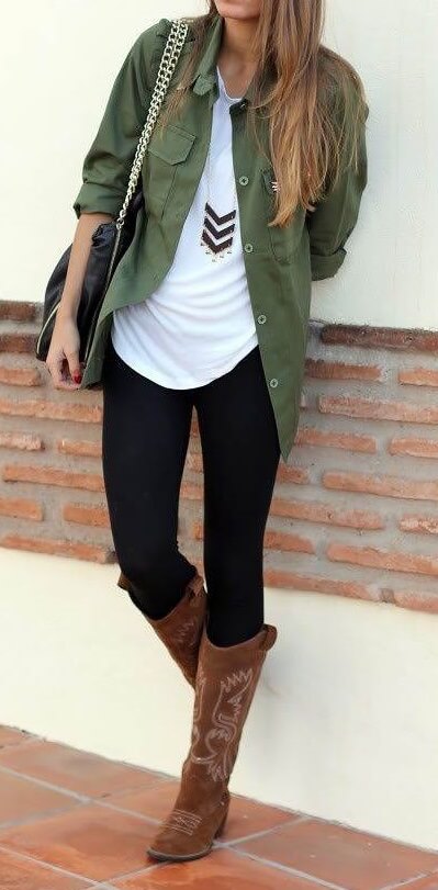 Woman wearing black leggings, white T-shirt, olive green shirt and brown boots