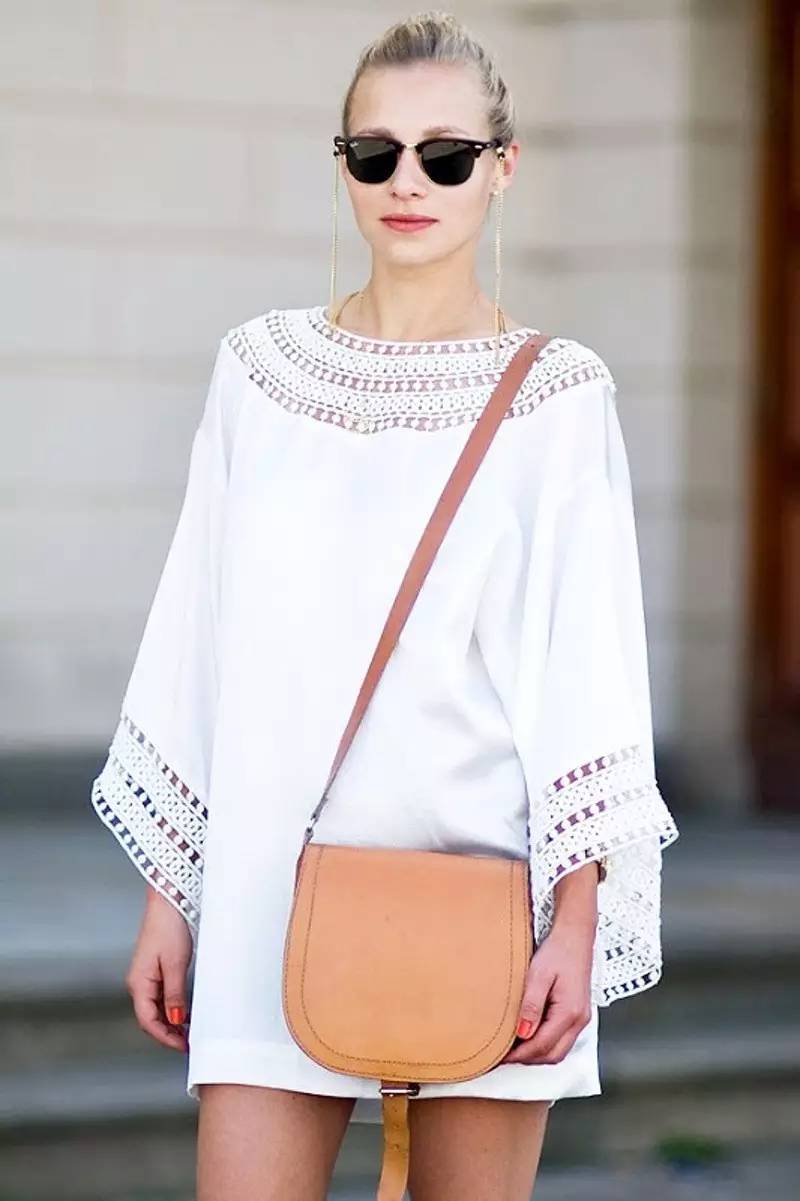 White and tan go together like wine and cheese. A boho white dress calls for boho accessories. We love the extra-long earrings and of course the simple tan bag