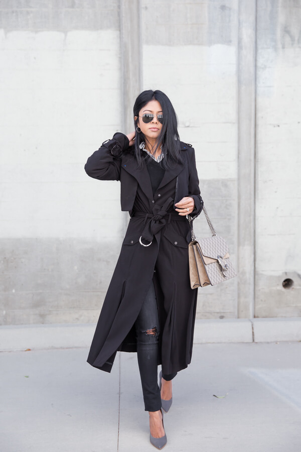 Beautiful lady with a layered outfit made of ribbed jeans, sweater and shirt dress worn like a trench.