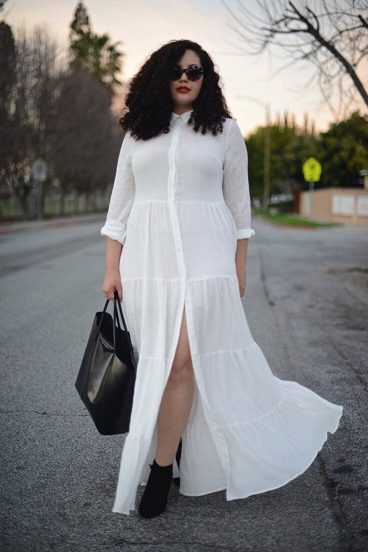 Wearing a long white ruffle dress