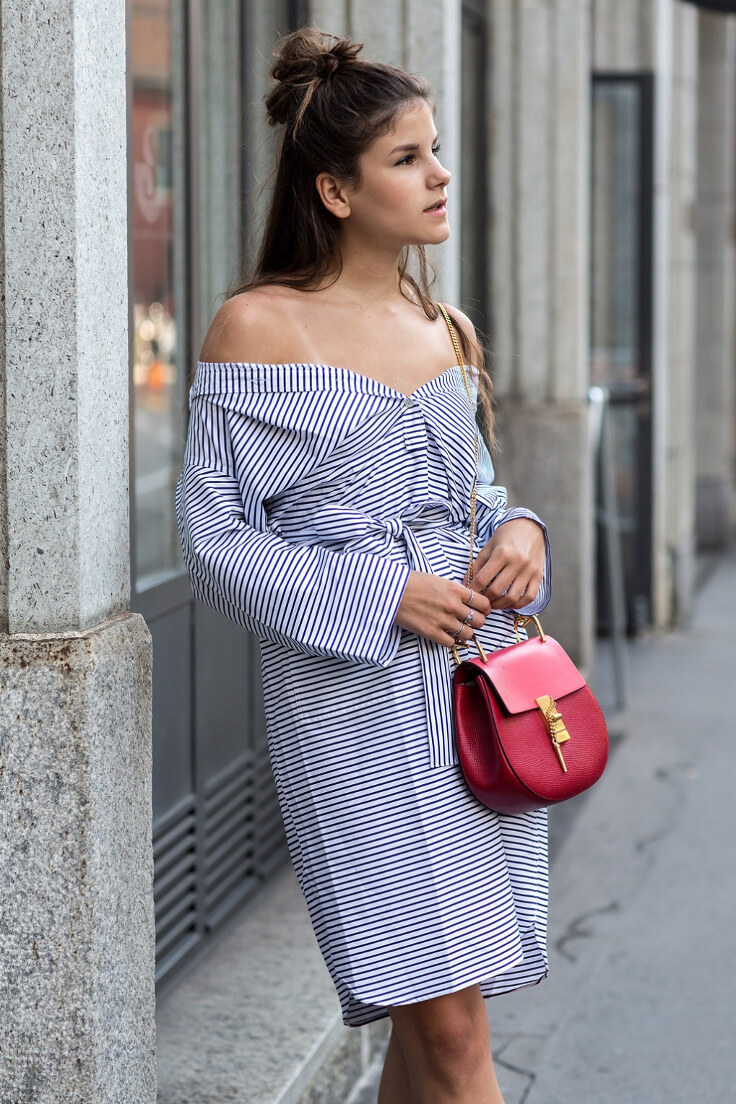 Woman wearing striped off-the-shoulder shirtdress