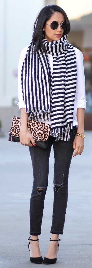 One of the biggest and most enduring trends from the past few months is undoubtedly stripes. Pair a two-toned scarf with a classic white blouse and black ripped skinny jeans for a timeless yet still trendy look.