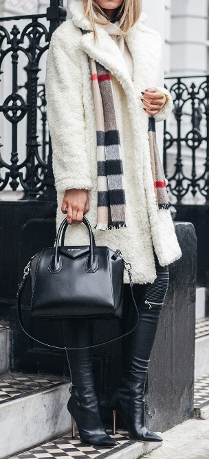 A winter white shearling coat meets black leather pants – here’s a combination made for fearless, edgy women with an eye for fashion. For an unexpected twist, drape a Burberry plaid scarf around your neck for a classic, old English effect.