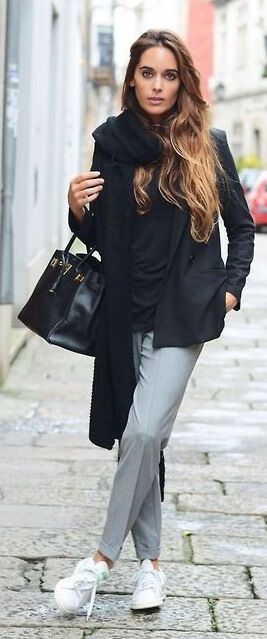 This look exemplifies modern French city style. Get that je ne sais quoi with the combination of simple gray tailored pants, a black sweater, and a black blazer. Top it all off with a long black scarf and trendy Adidas Stan Smith sneakers.