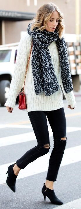 A chunky woolen scarf and a plush lamb's wool sweater are all you need to warm up on a dreary fall day.