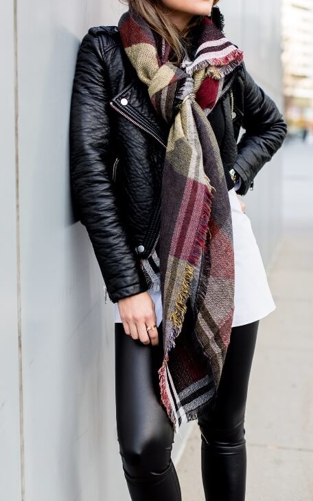 Fall weather brings the welcome return of edgy black leather. Add some color and dimension to the urban look with a long-printed plaid scarf.