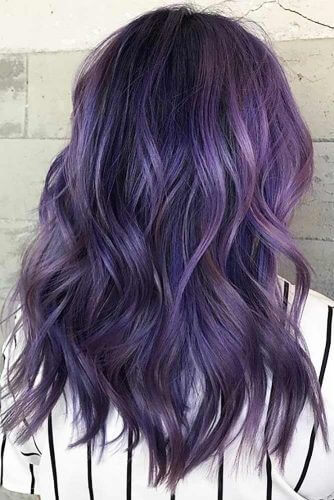 Mixing hints of black into a full base of purple, this look is a beautiful option for deeper skin tones.