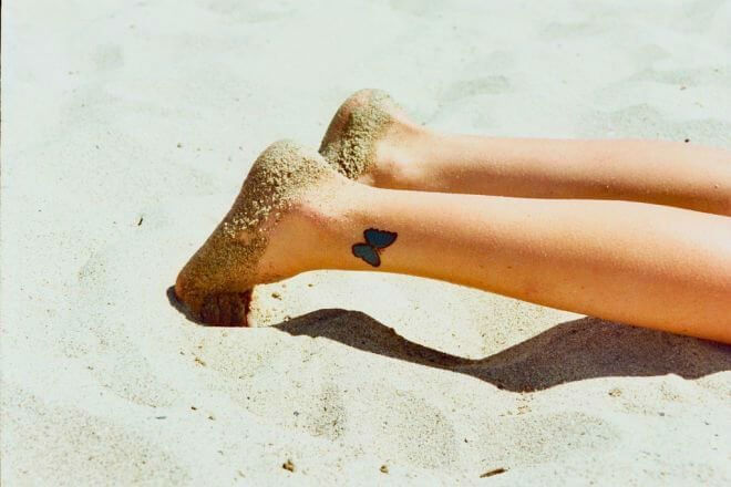 A blue butterfly on your ankle wrist is one of the classy tattoos, and it will never be out of style #summertattoo #minitattoo #minimalisttattoo #colorfultattoo