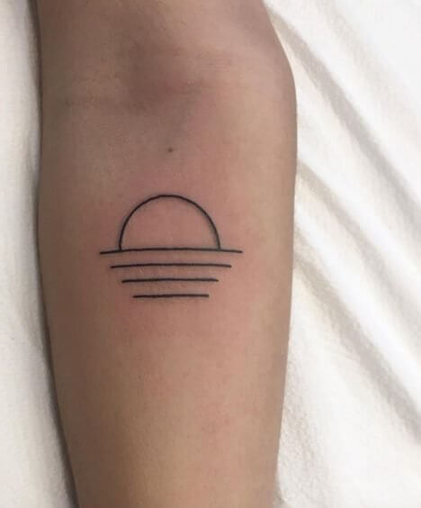 Tiny lines in minimalistic style and a small sun never looked better on a tattoo. Whether it is black or you add a splash of colors, your tattoo will be noticeable. #summertattoo #minitattoo #minimalisttattoo