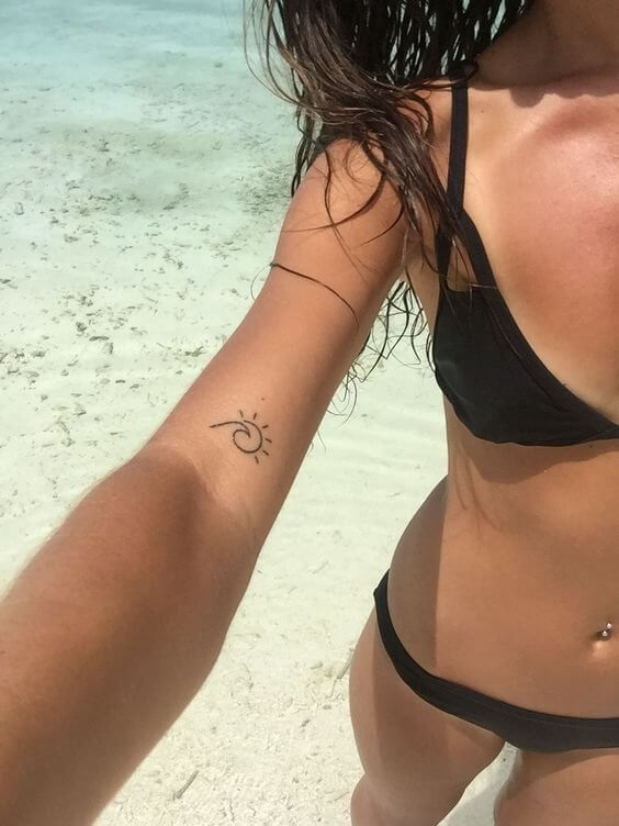 Combining two symbols into one is a fantastic idea! You can ‘copy’ this girl’s sun-wave tattoo - it is perfect for minimal tattoo lovers. #summertattoo #minitattoo #minimalisttattoo