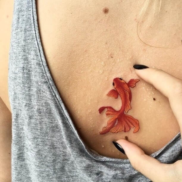 This fish tattoo seems so real. It looks like it is 3D #summertattoo #colorfultattoo