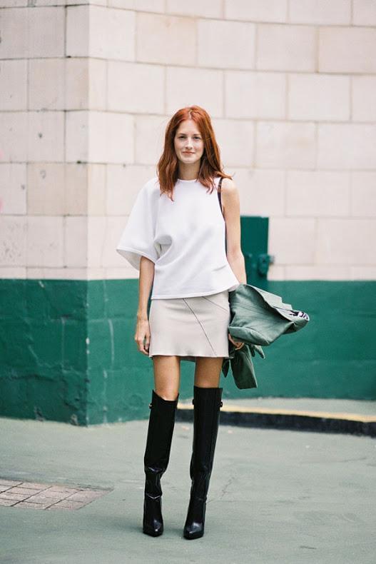 Mini skirt with white asymmetric blouse and black over the knee boots
