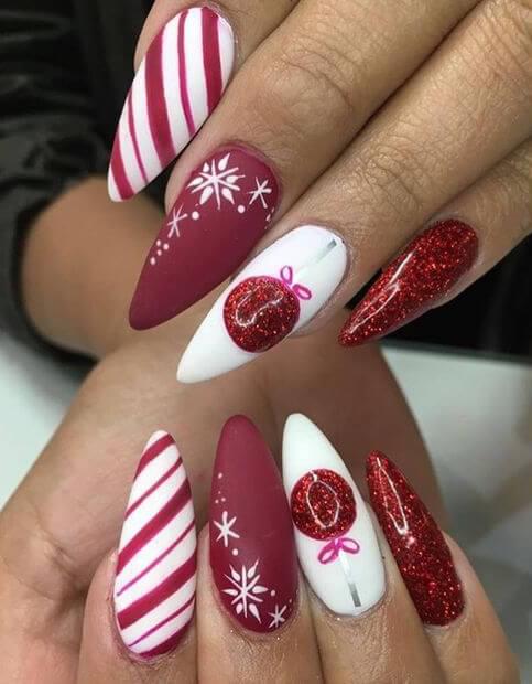Stiletto nails are not for everyone. Brave girls will wear them along with all Christmas details on. #winternails #naildesign