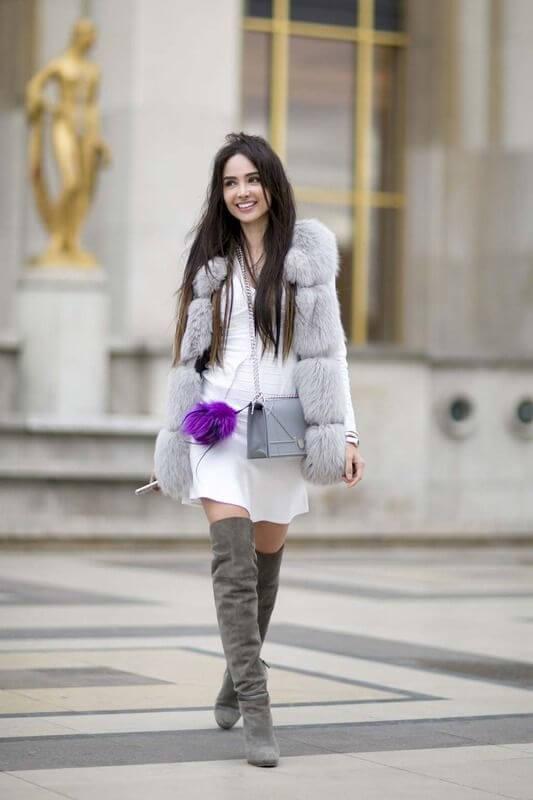 Faux fur vest and thigh-high boots will be your main alliances when cold winter time comes. The white and grey combination is always a good idea. #highboots #winteroutfits