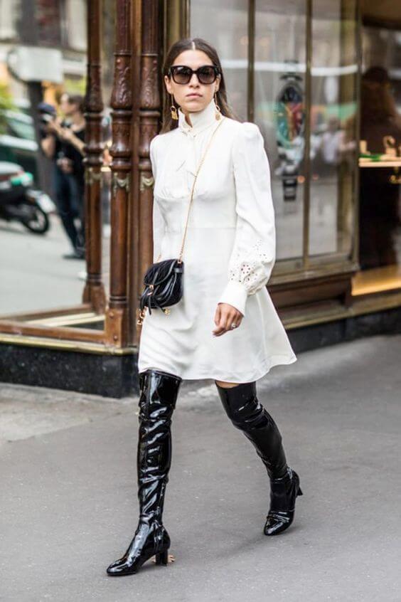 Patent leather might seem intimidation to wear, but when it comes to boots, everything is allowed. White and black combinations are timeless. #highboots #winteroutfits