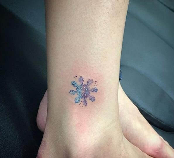 Tiny, cute watercolor snowflake tattoo #wintertattoo