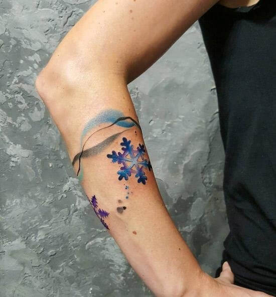 Snowflake tattoos with blue and black lines #wintertattoo