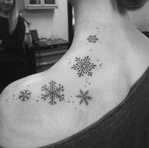 Little snowflake tattoos on the back #wintertattoo