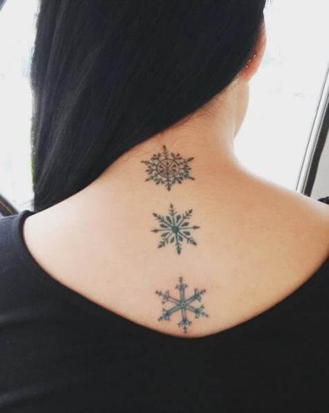 Snowflakes along the spine #wintertattoo