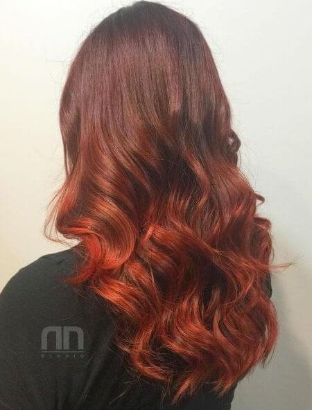 Beautiful locks can be even more highlighted with lovely burning auburn hair ombre.