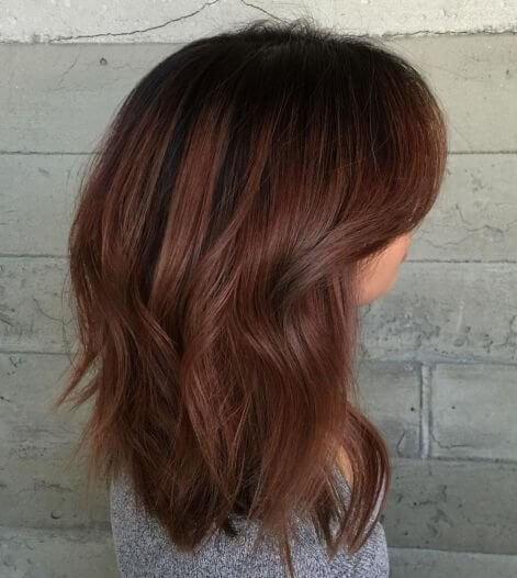 Dye your hair in chocolate brown with auburn highlights
