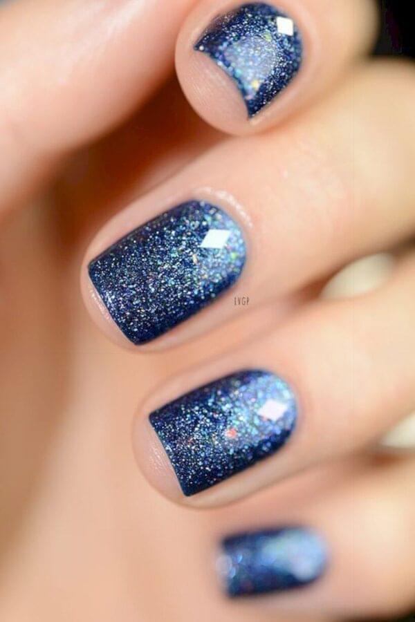 Glitter will make your nails look like a midnight sky