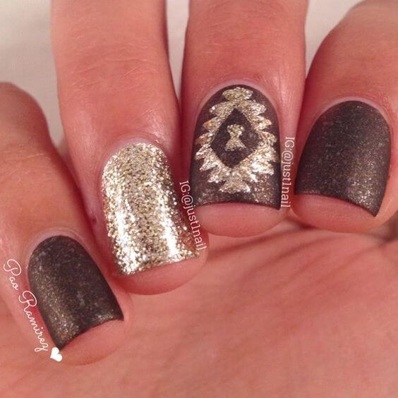 Test your nail art skills with a geometric glitter design.