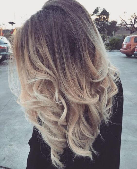 medium-length light brown hair with blonde ombre starting from the ear down