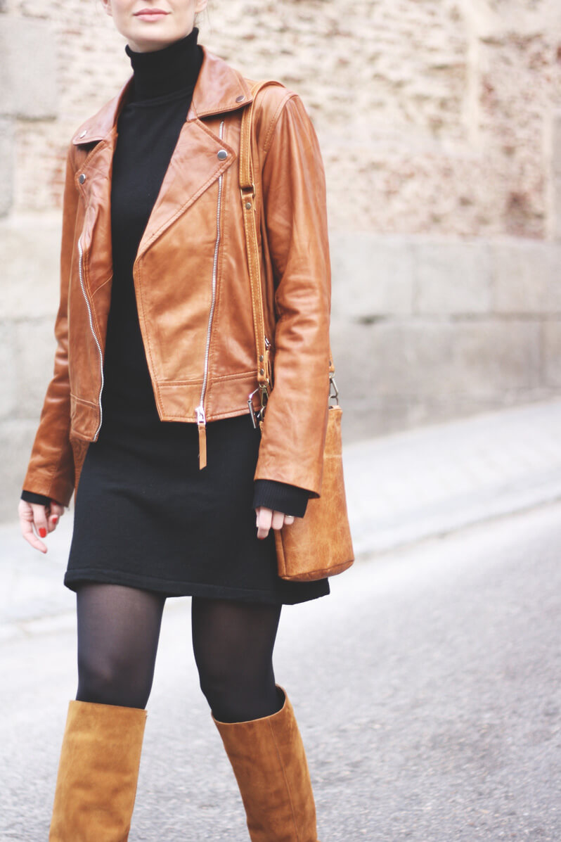 Woman in brown leather jacket
