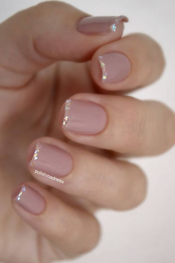 This nail design is a very minimal take on the French manicure.