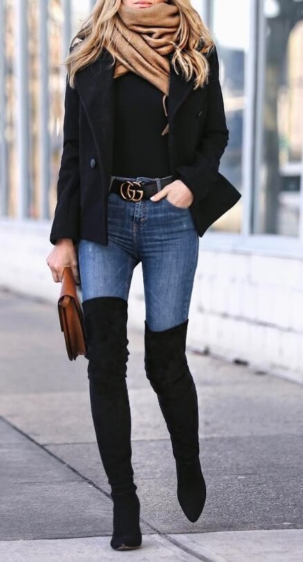 A simple beige scarf adds a pop of color to this sexy street style look. Combine your denims with basic black for the similar off-duty model style.