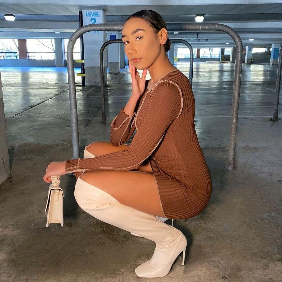 A girl in white thigh-high boots