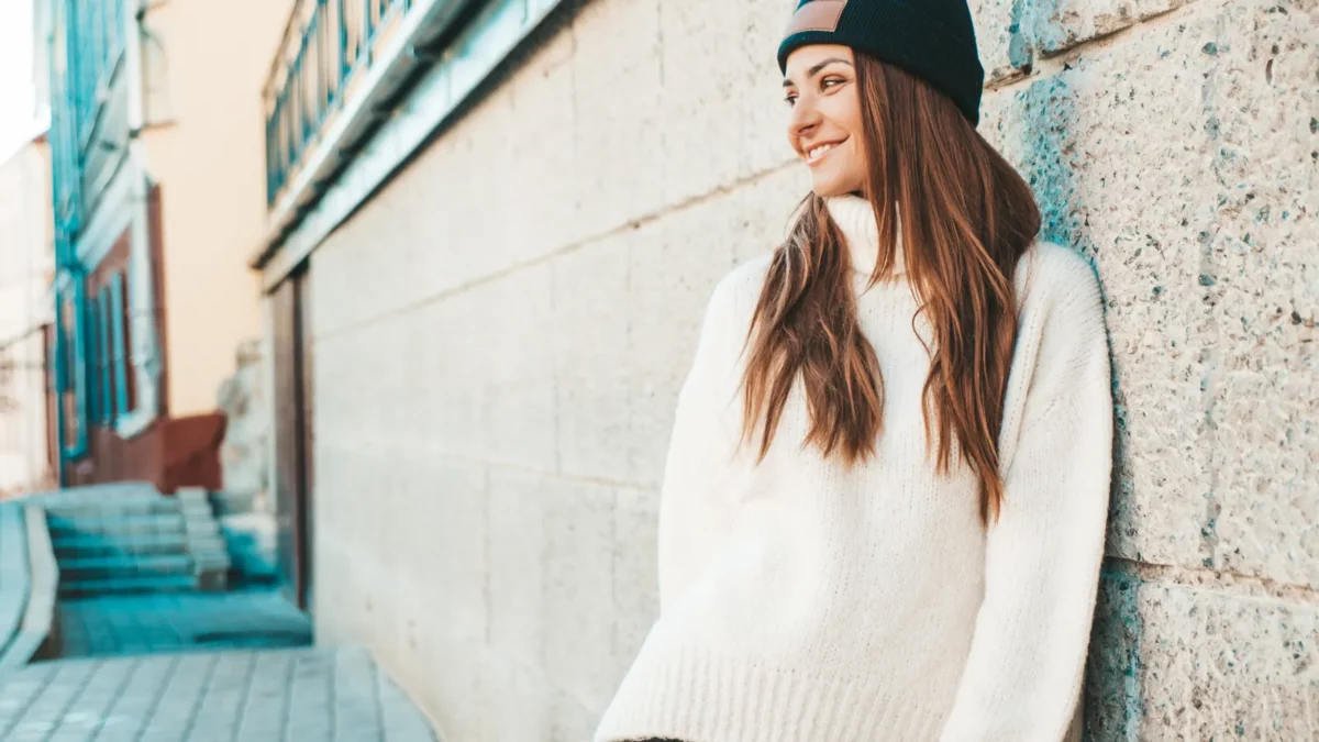 Girl dressed in warm hipster white sweater